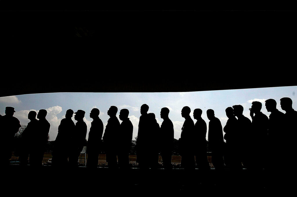 A line of men walking